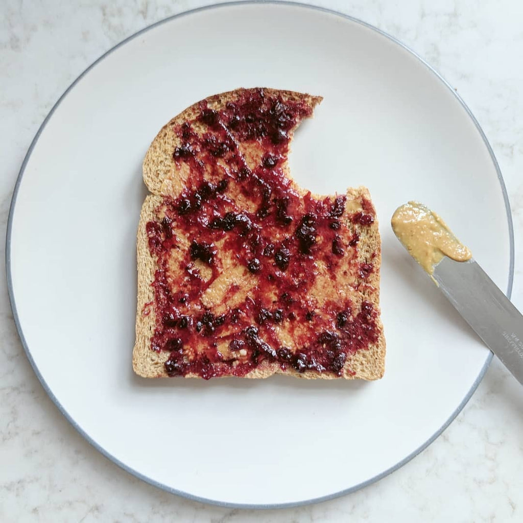 Butter Nut of London's Smooth Peanut Butter on toast with jam.
