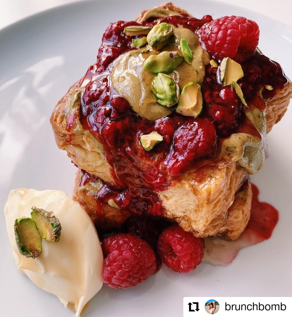 French toast topped with raspberries and Butter Nut of London's Pistachio & Rose nut butter | Photo by @brunchbomb