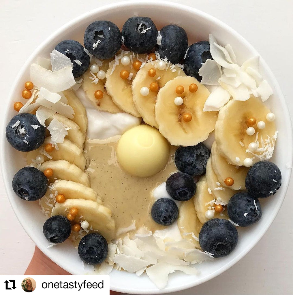 Porridge topped with coconut, banana, blueberries and Butter Nut of London's Cashew Coconut Cardamom nut butter | Photo by @onetastyfeed